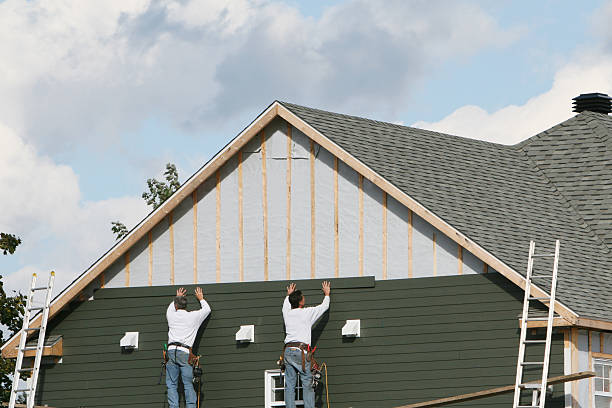 Professional Storm Damage Siding Repair technician working in New Prague, MN